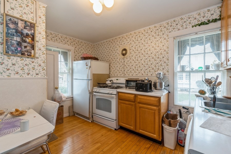 796 Green Bay Road Winnetka, IL 60093 - Photo 6 of 14 a kitchen with stainless steel appliances granite countertop a stove and a refrigerator
