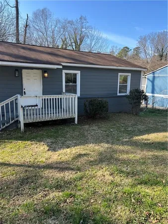 front view of a house with a yard