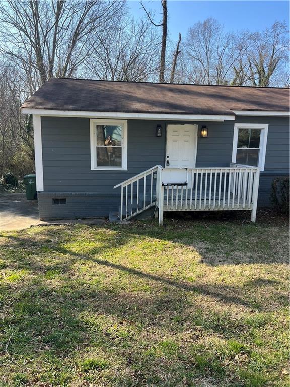 2298 Swallow Circle Southeast Atlanta, GA 30315 - Photo 2 of 10 a view of a house with a yard and roof deck