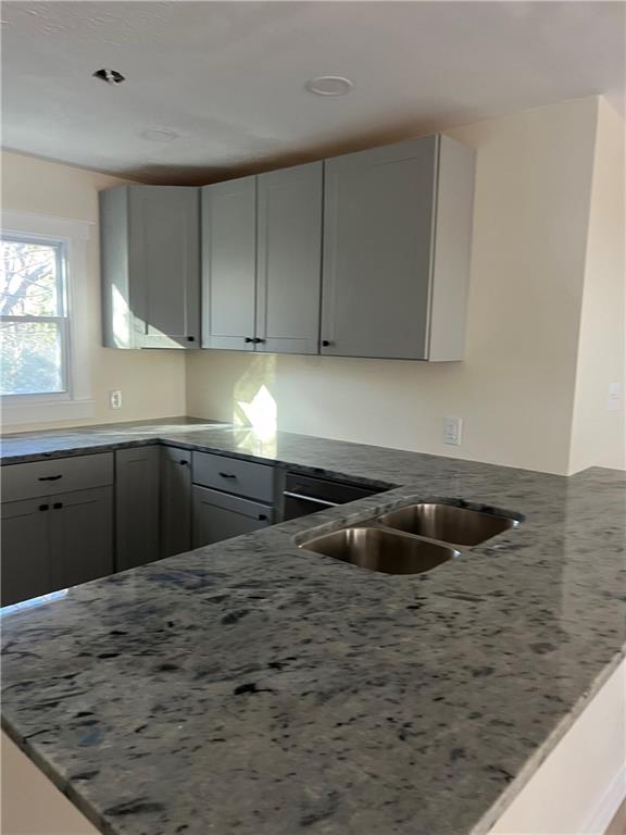 2298 Swallow Circle Southeast Atlanta, GA 30315 - Photo 4 of 10 a kitchen with granite countertop a sink and a stove