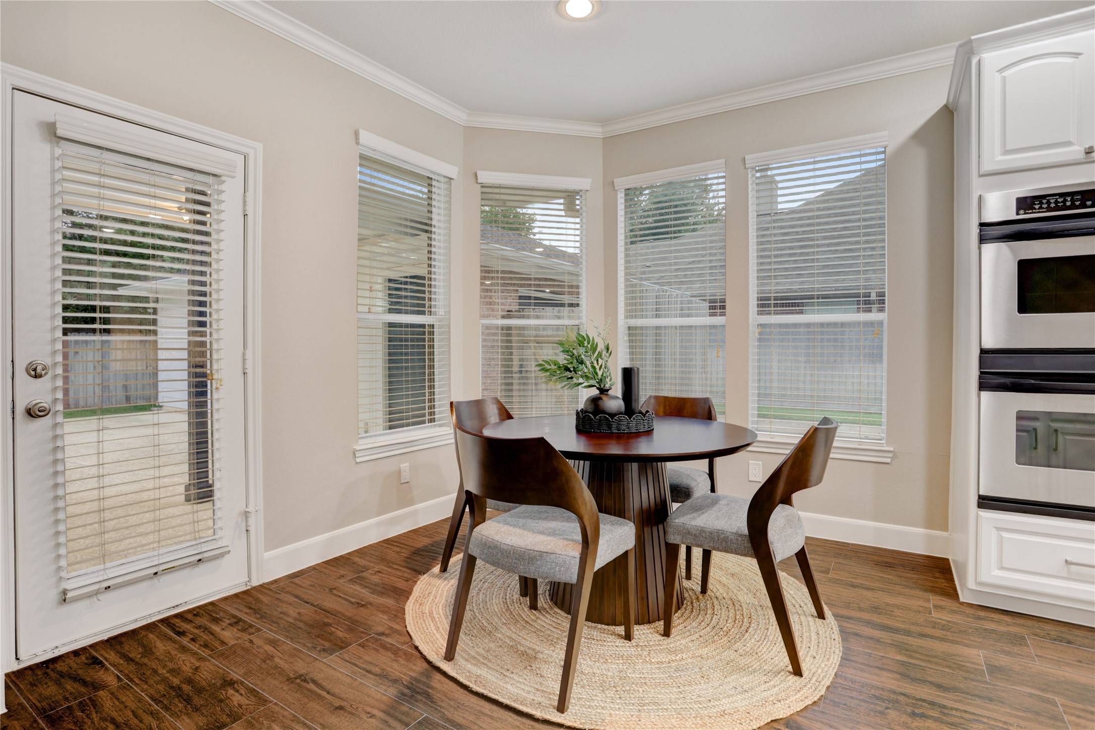 24418 Falcon Point Drive Katy, TX 77494 - Photo 13 of 40 a view of a dining room with furniture and wooden floor