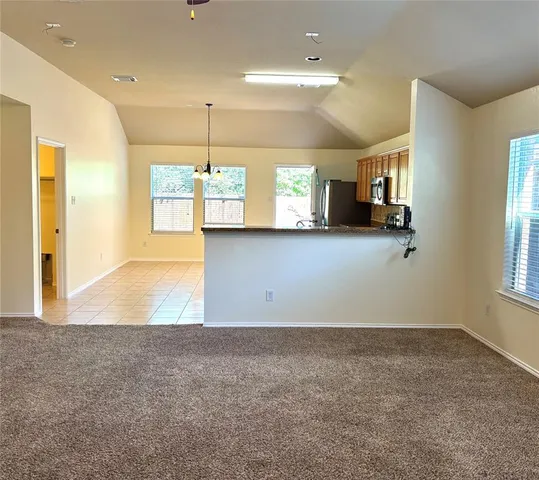 a view of a kitchen with a sink and cabinets