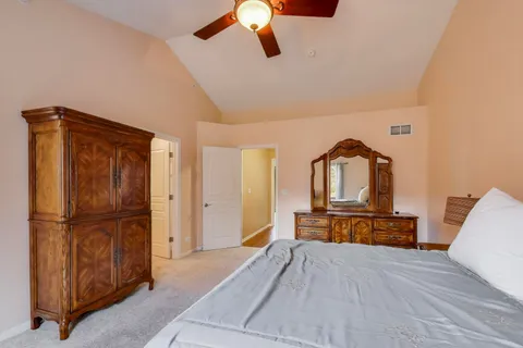 a bedroom with a bed and a dresser