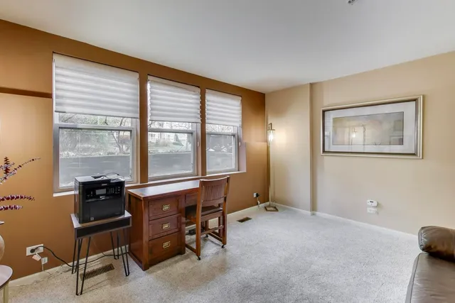 a workspace with furniture and windows