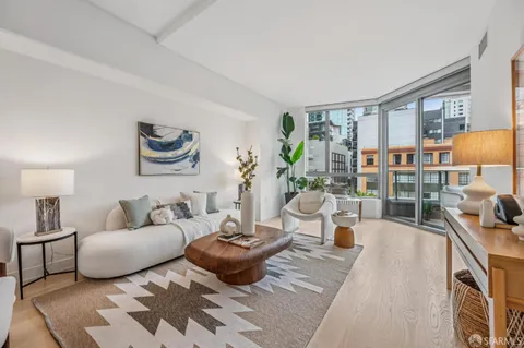 a living room with furniture and a table