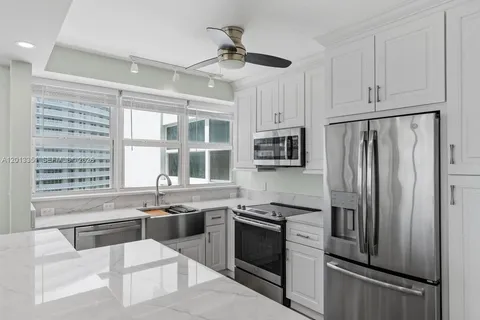 a kitchen with a sink and a window