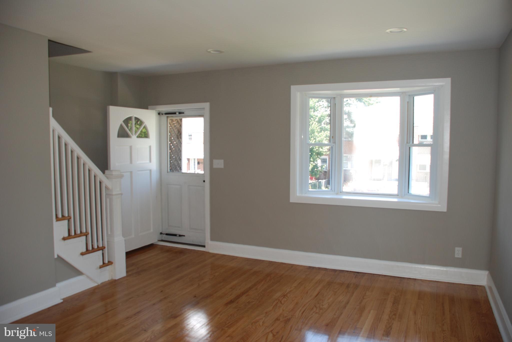 139 West Meadow Road Baltimore, MD 21225 - Photo 5 of 11 a view of a livingroom with wooden floor and a window