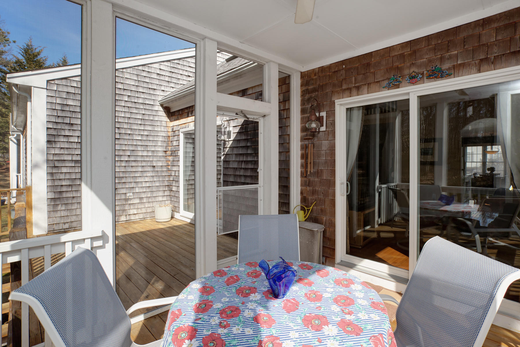 20 Stratford Ridge, Unit 124 Mashpee, MA 02649 - Photo 30 of 34 a bedroom with a bed and glass door