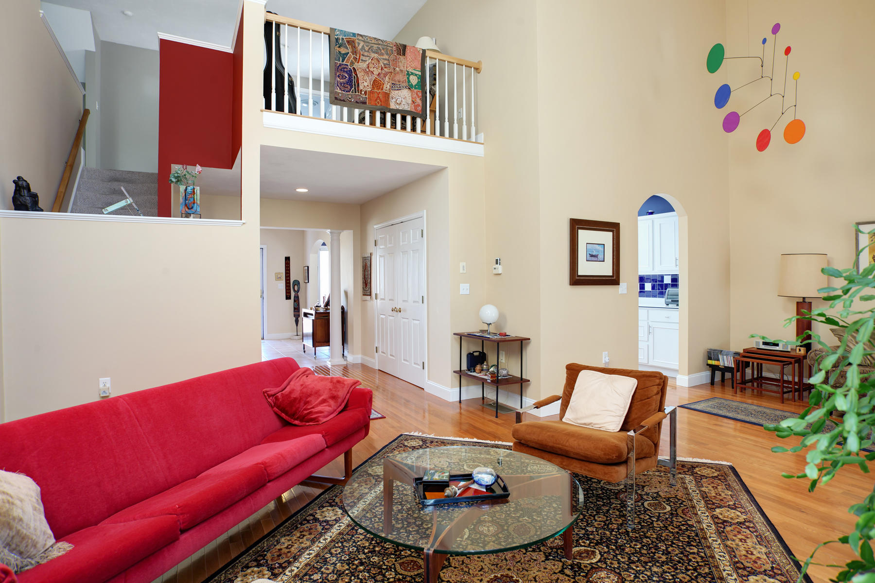 20 Stratford Ridge, Unit 124 Mashpee, MA 02649 - Photo 3 of 34 a living room with furniture and a rug