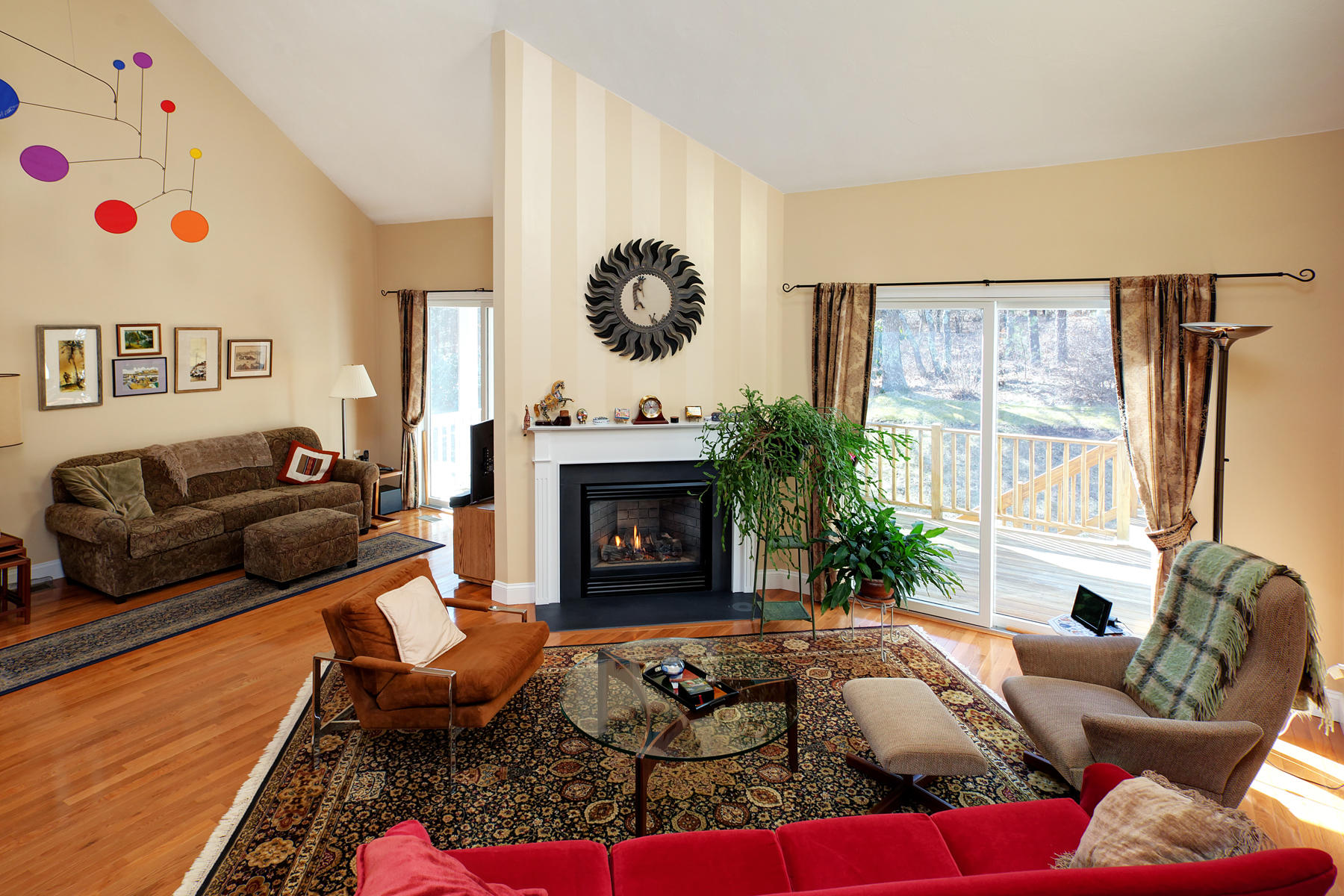 20 Stratford Ridge, Unit 124 Mashpee, MA 02649 - Photo 6 of 34 a living room with furniture fireplace and a large window