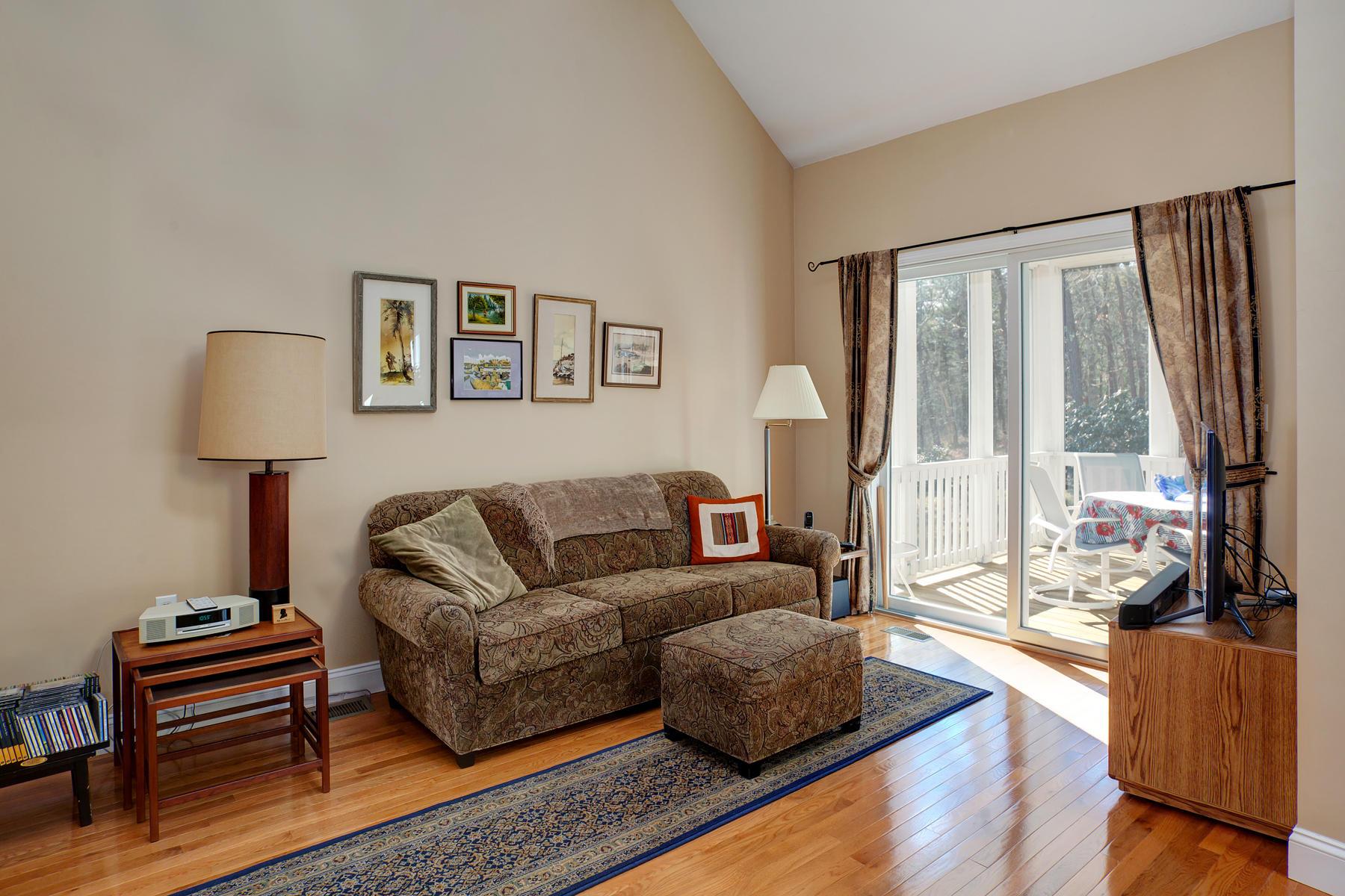 20 Stratford Ridge, Unit 124 Mashpee, MA 02649 - Photo 8 of 34 a living room with furniture and a large window