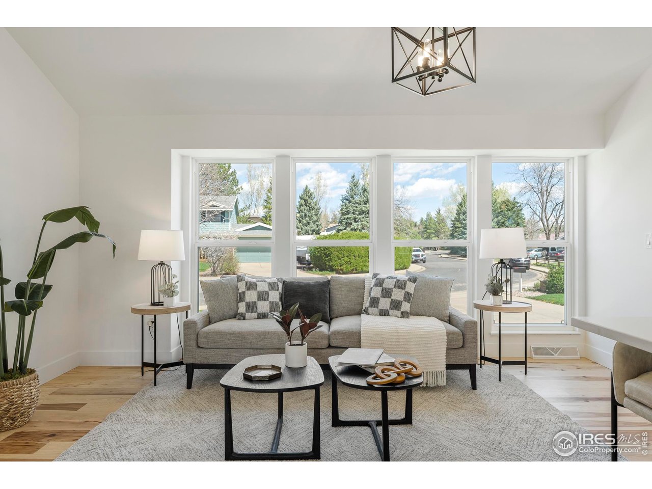 4223 Peach Way Boulder, CO 80301 - Photo 13 of 40 a living room with furniture and floor to ceiling windows