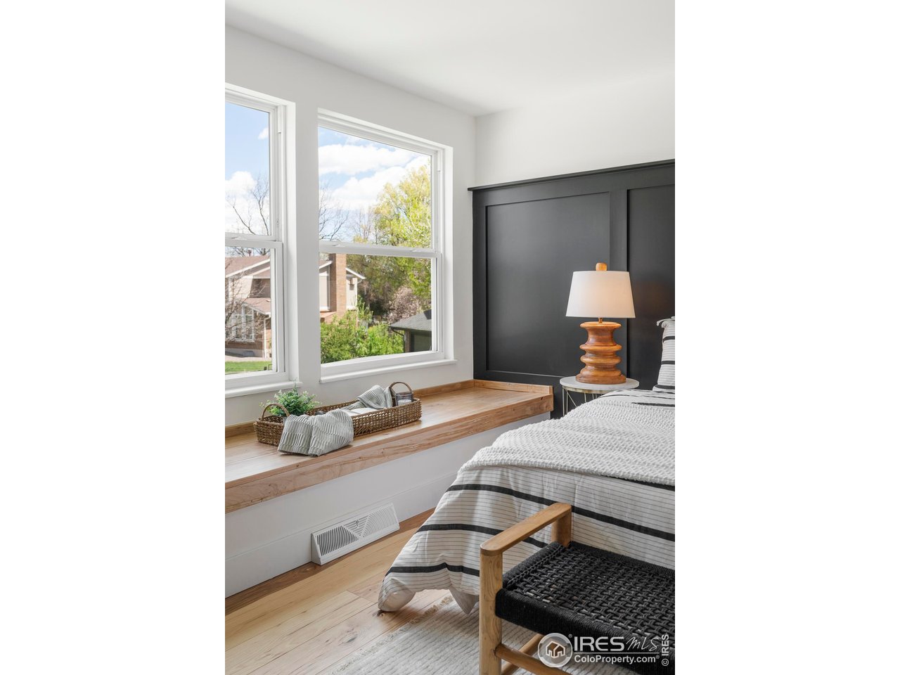 4223 Peach Way Boulder, CO 80301 - Photo 26 of 40 a bedroom with a bed and a large window