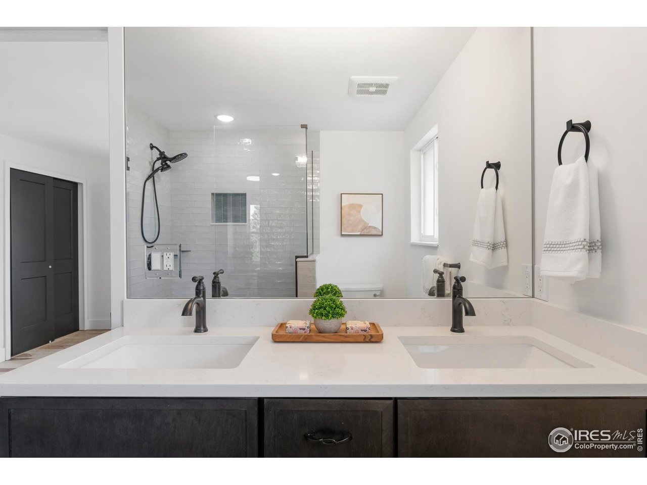 4223 Peach Way Boulder, CO 80301 - Photo 27 of 40 a bathroom with a sink double vanity and a mirror