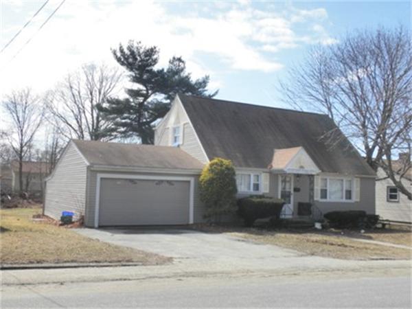 27 Durfee Road Tiverton, RI 02878 - Photo 2 of 7 a view of a house with a yard and garage