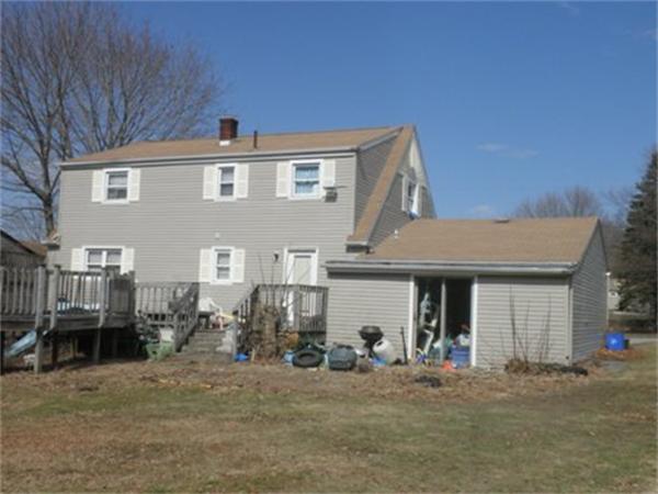 27 Durfee Road Tiverton, RI 02878 - Photo 3 of 7 a front view of a house with a yard