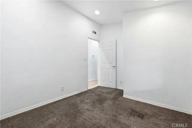 an empty room with an entryway door