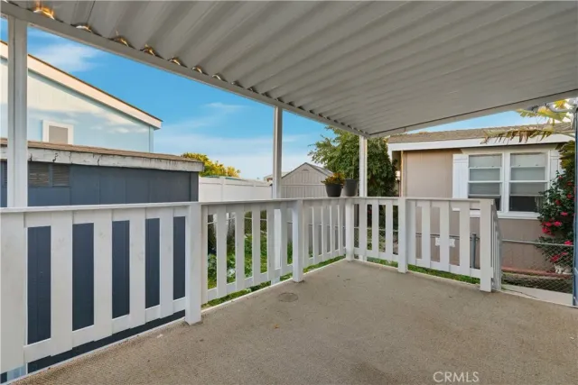 a balcony with wooden floor