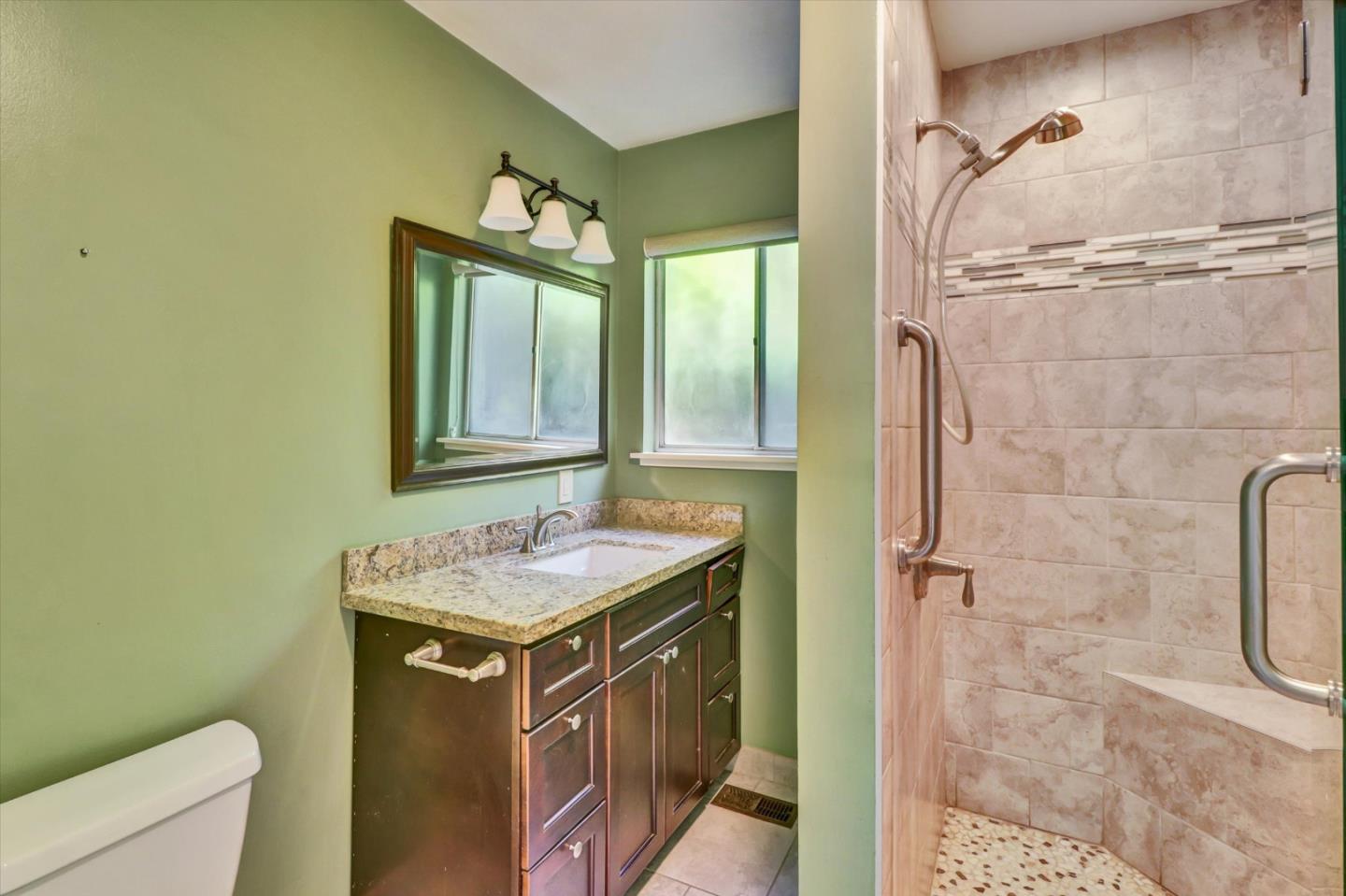 331 David Avenue Campbell, CA 95008 - Photo 18 of 32 a bathroom with a granite countertop sink a toilet and shower