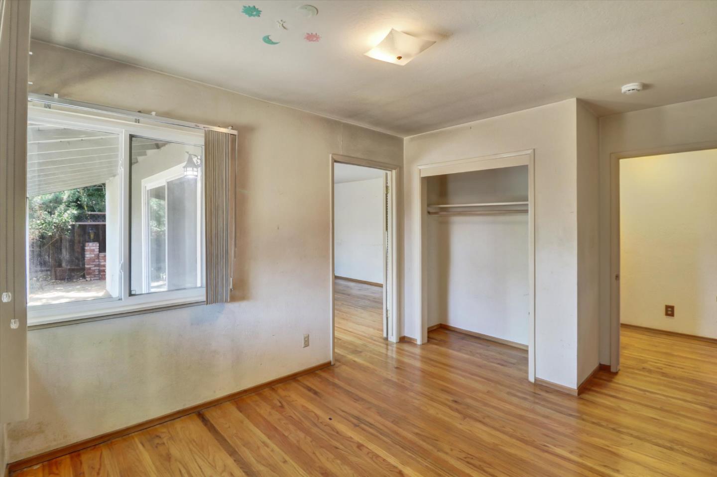 331 David Avenue Campbell, CA 95008 - Photo 21 of 32 an empty room with wooden floor and windows