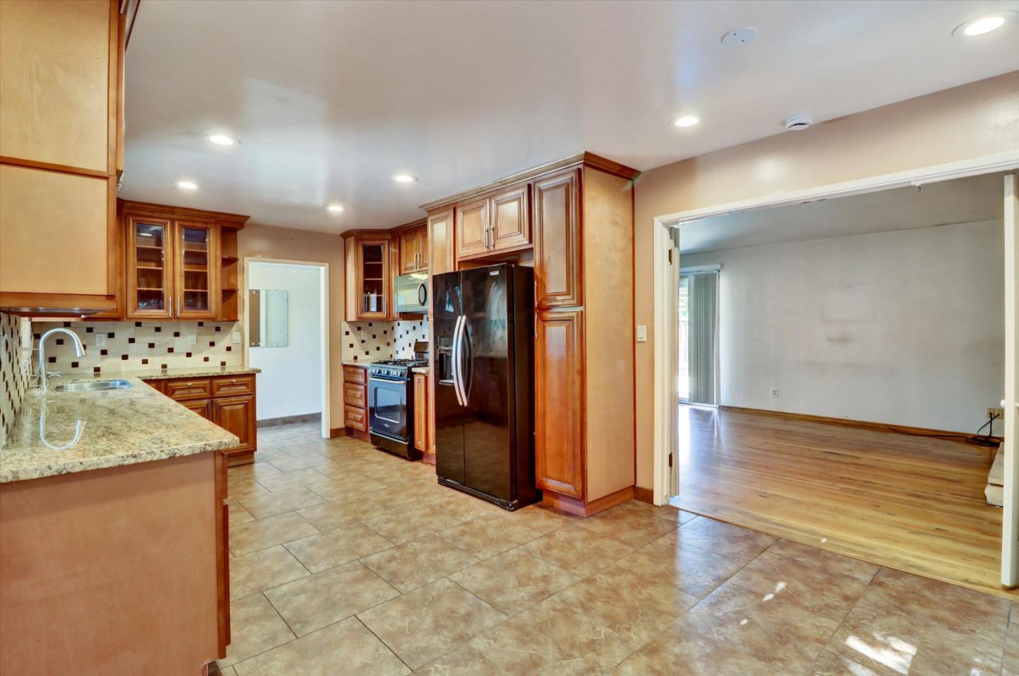 331 David Avenue Campbell, CA 95008 - Photo 5 of 32 a kitchen with stainless steel appliances granite countertop a refrigerator and a sink