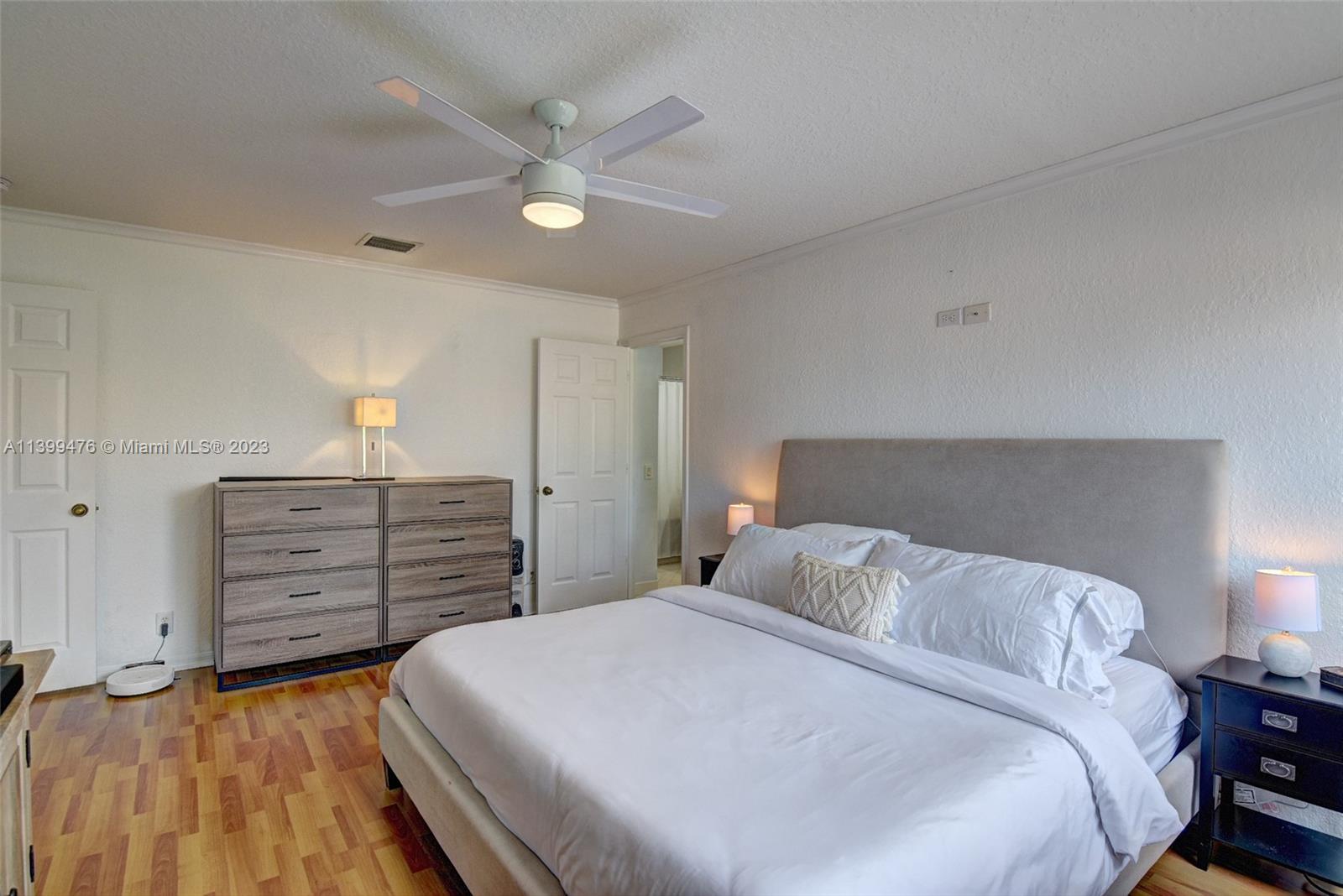 471 Fishtail Terrace Weston, FL 33327 - Photo 16 of 33 a bedroom with a bed and a dresser