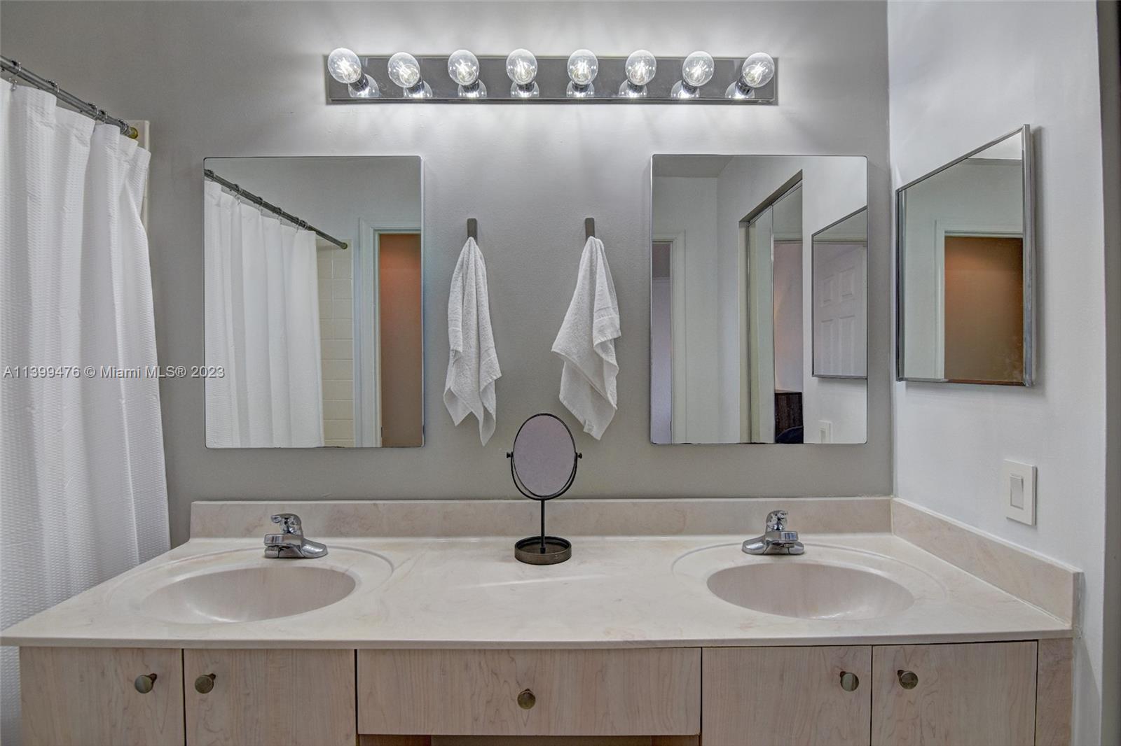471 Fishtail Terrace Weston, FL 33327 - Photo 17 of 33 a bathroom with a sink and a mirror