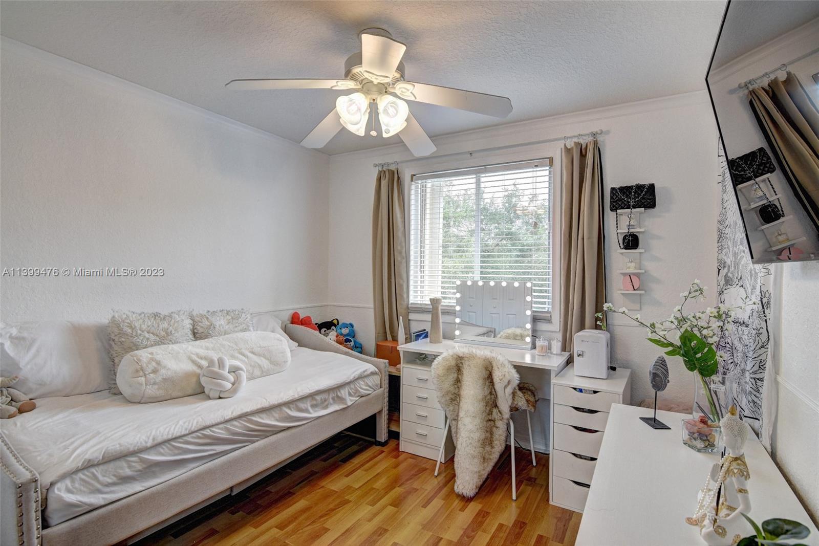 471 Fishtail Terrace Weston, FL 33327 - Photo 20 of 33 a bedroom with a bed and a chandelier