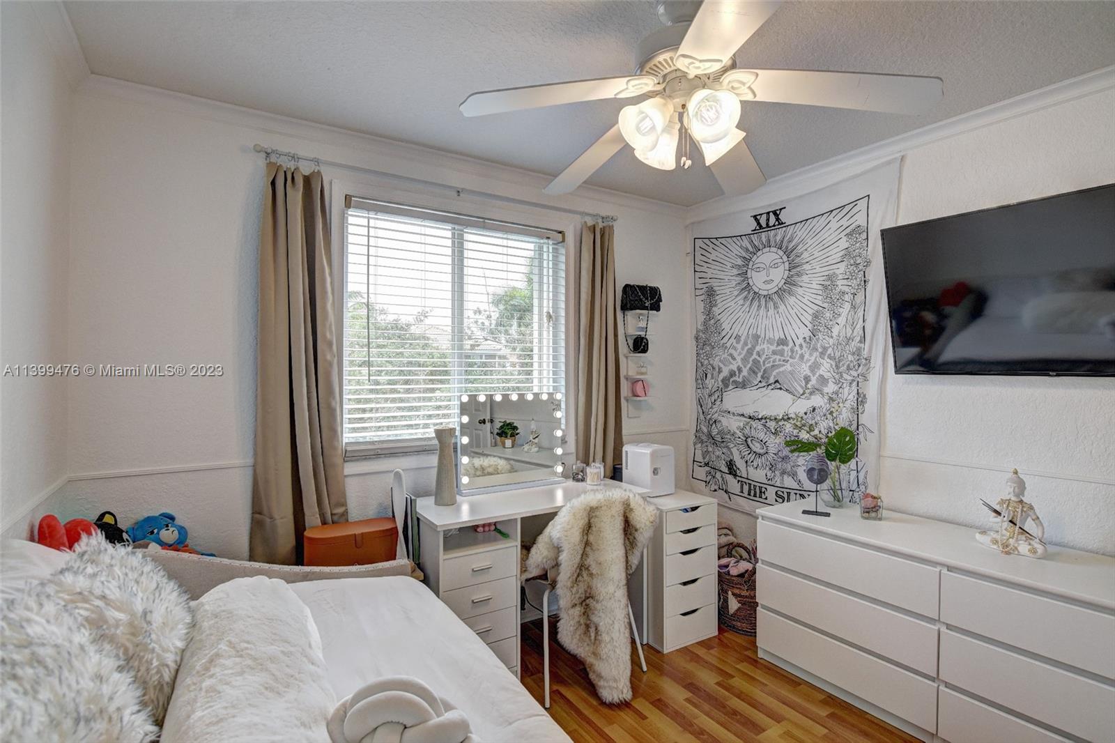 471 Fishtail Terrace Weston, FL 33327 - Photo 21 of 33 a bedroom with a bed and a flat screen tv