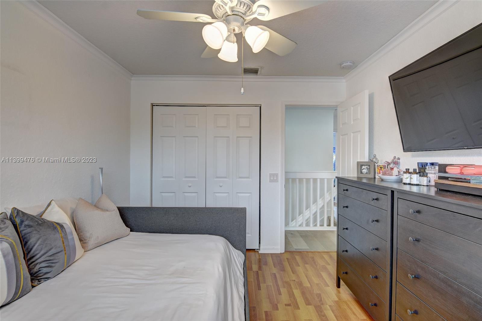 471 Fishtail Terrace Weston, FL 33327 - Photo 23 of 33 a bedroom with a bed and a flat screen tv