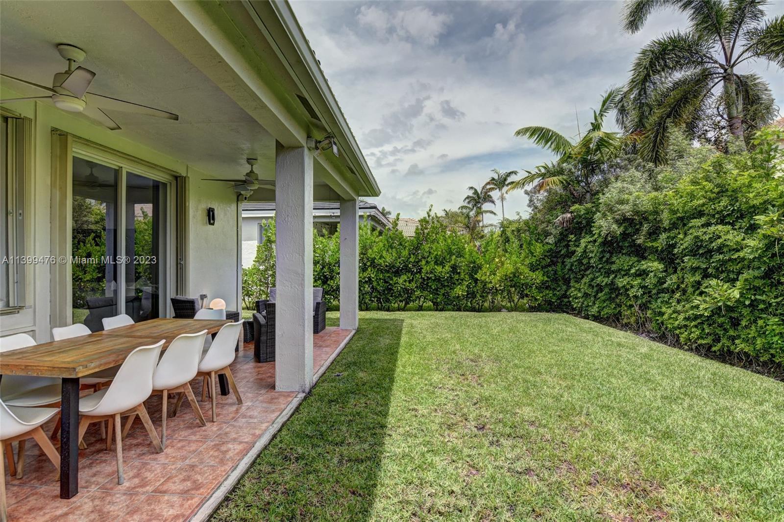 471 Fishtail Terrace Weston, FL 33327 - Photo 29 of 33 a view of an outdoor space with furniture and garden