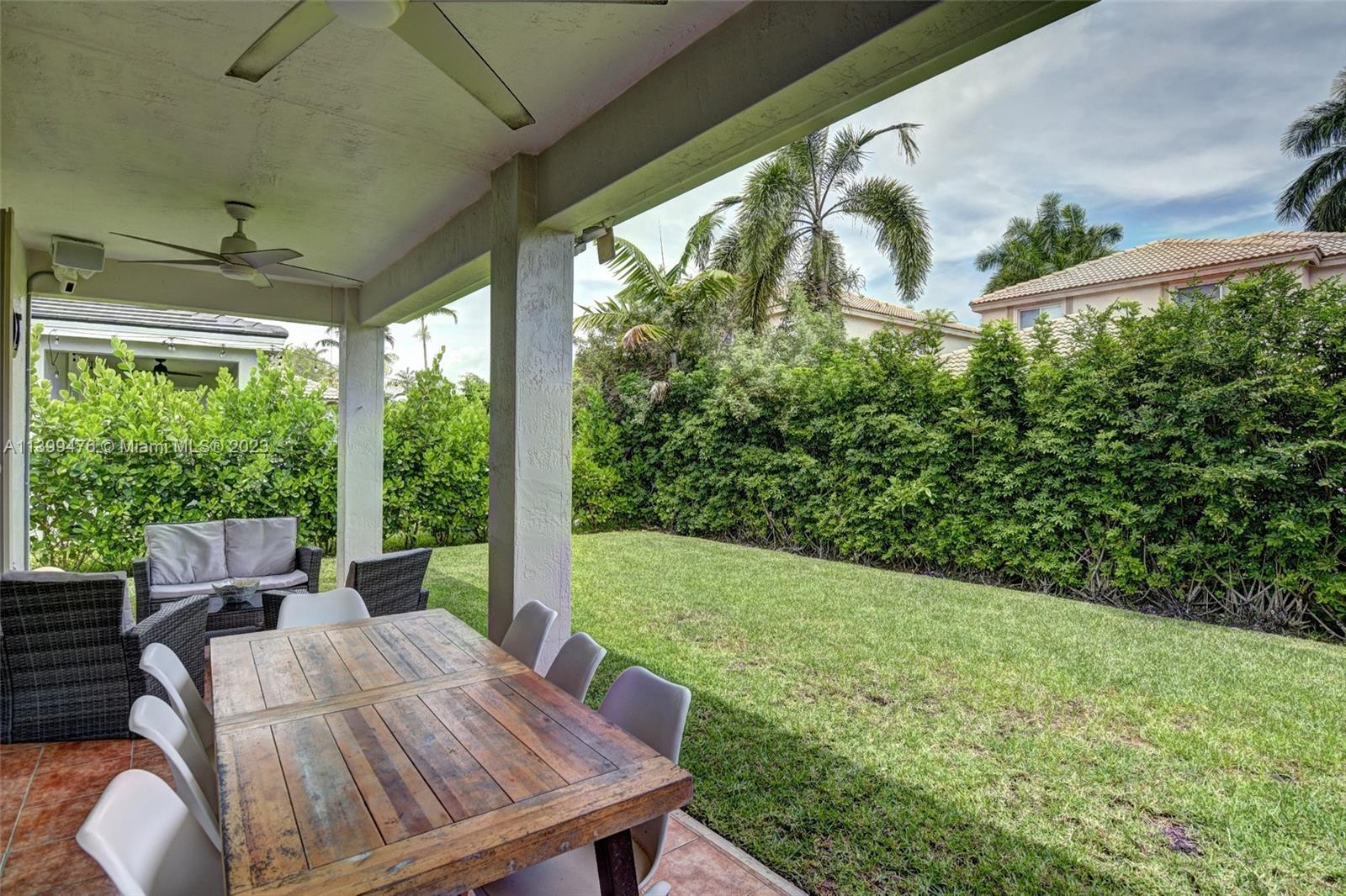 471 Fishtail Terrace Weston, FL 33327 - Photo 30 of 33 a outdoor view with a seating space