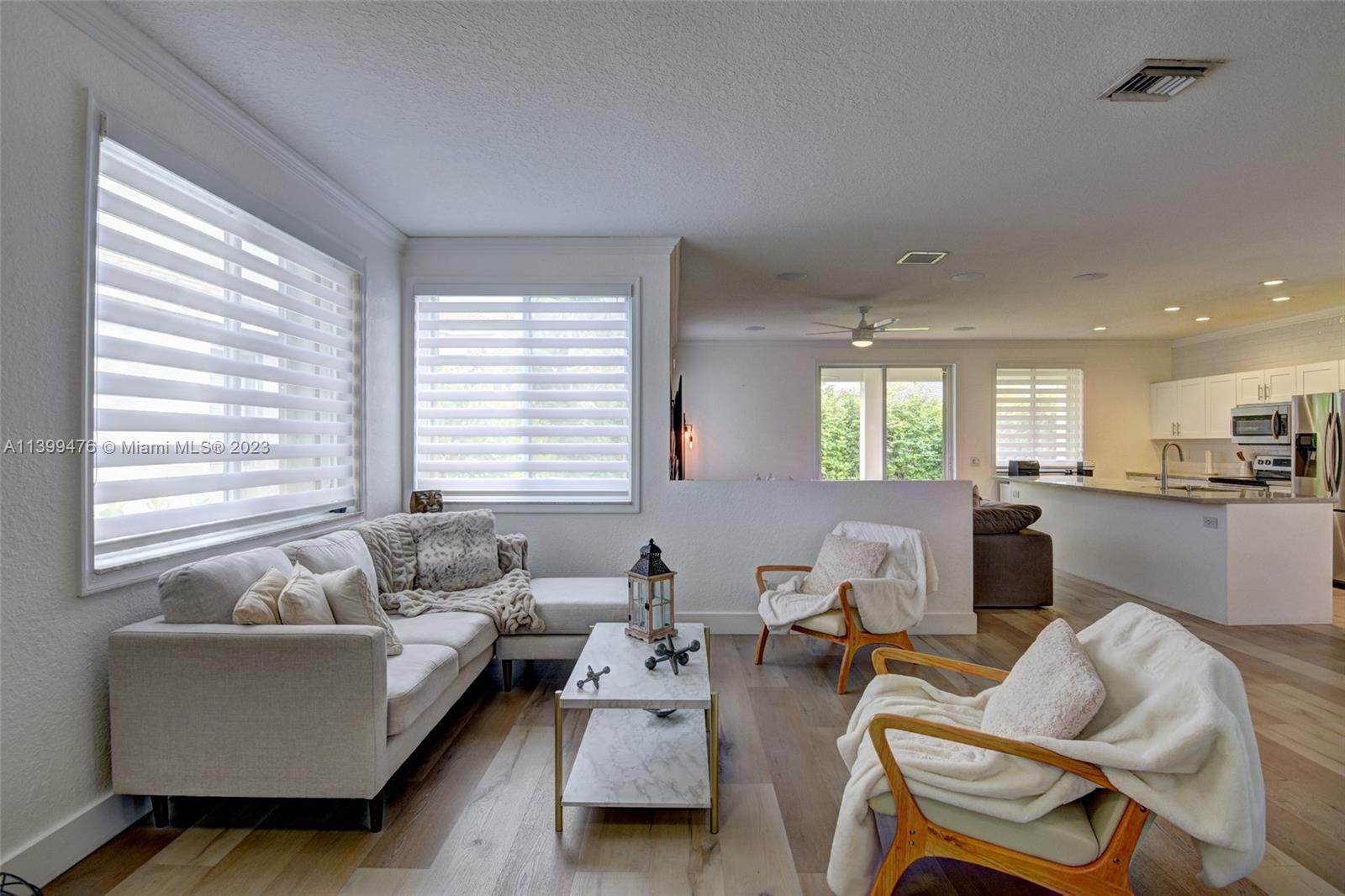 471 Fishtail Terrace Weston, FL 33327 - Photo 4 of 33 a living room with furniture and a window