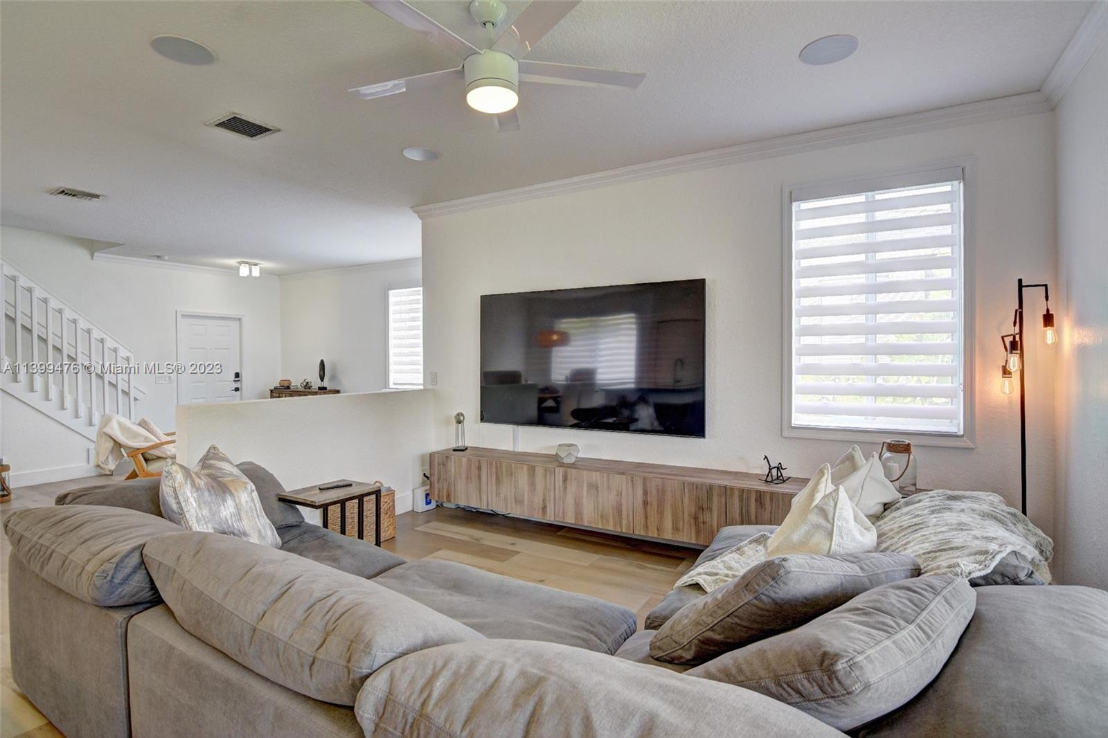 471 Fishtail Terrace Weston, FL 33327 - Photo 5 of 33 a living room with furniture and a flat screen tv
