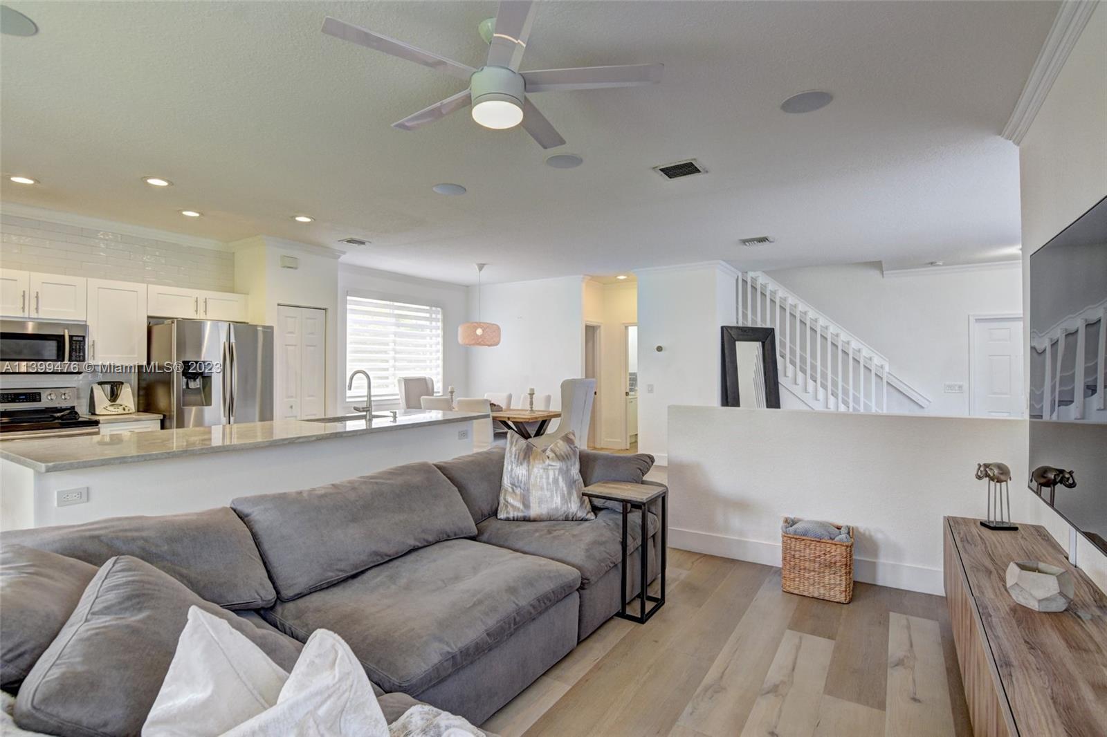 471 Fishtail Terrace Weston, FL 33327 - Photo 6 of 33 a living room with furniture and a view of kitchen