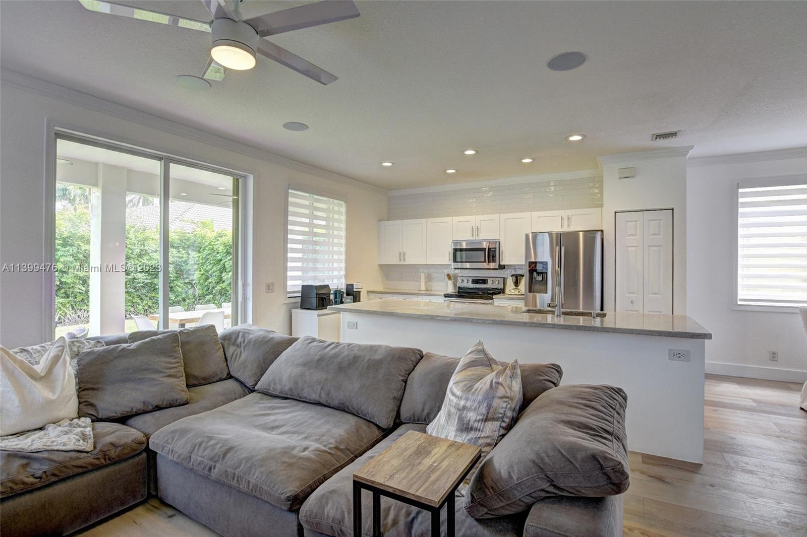 471 Fishtail Terrace Weston, FL 33327 - Photo 7 of 33 a living room with furniture and a large window
