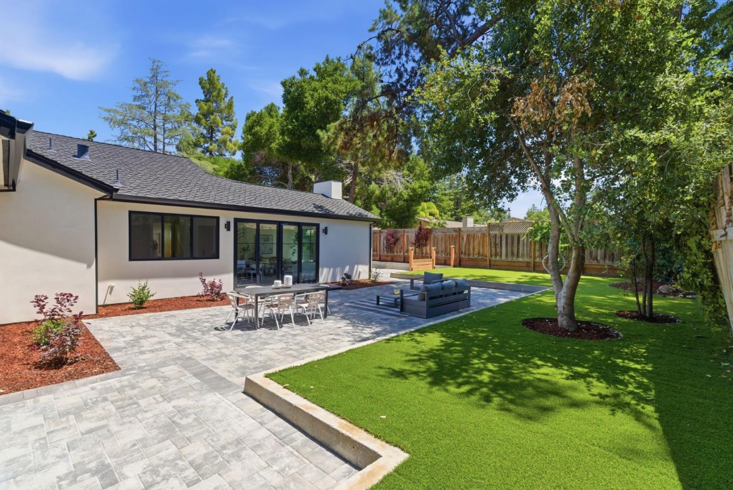 680 North San Antonio Road Los Altos, CA 94022 - Photo 19 of 19 a view of a house with backyard sitting area and garden