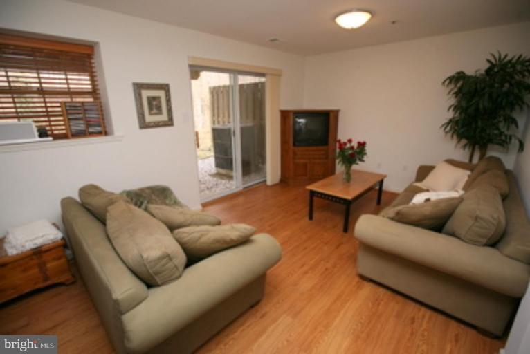 3323 Sea Port Way Silver Spring, MD 20902 - Photo 11 of 29 a living room with furniture and a flat screen tv