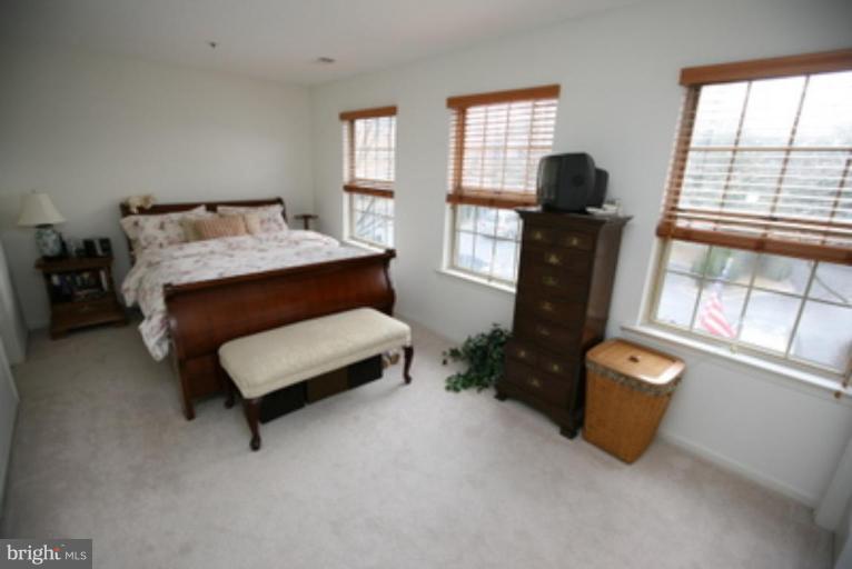 3323 Sea Port Way Silver Spring, MD 20902 - Photo 12 of 29 a bedroom with furniture and a window