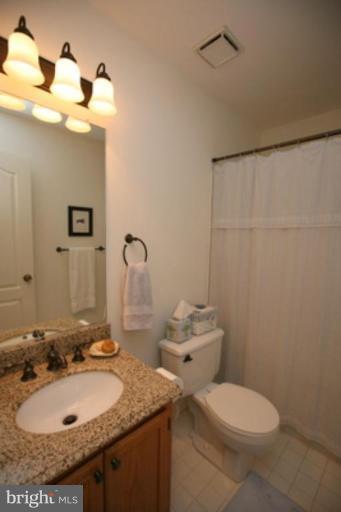 3323 Sea Port Way Silver Spring, MD 20902 - Photo 16 of 29 a bathroom with a sink toilet and mirror