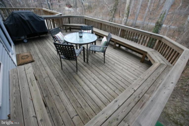 3323 Sea Port Way Silver Spring, MD 20902 - Photo 17 of 29 a view of balcony with wooden floor and outdoor seating