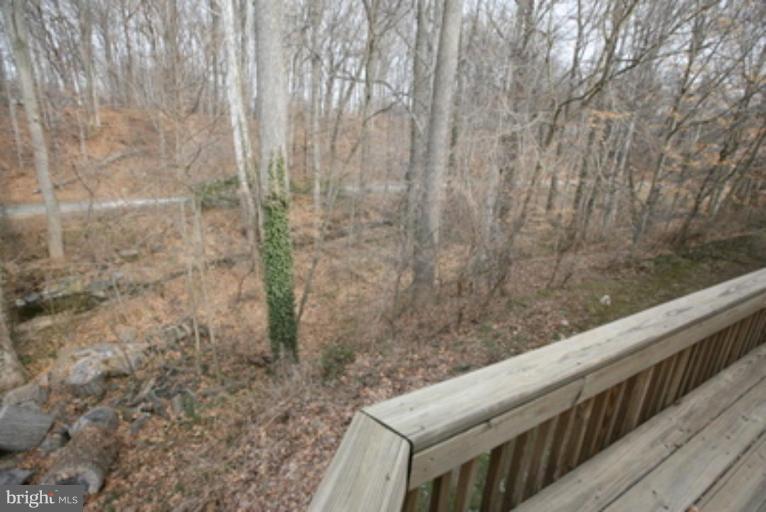 3323 Sea Port Way Silver Spring, MD 20902 - Photo 19 of 29 a view of balcony with wooden floor and fence