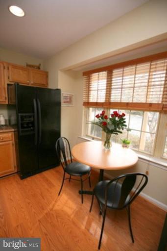 3323 Sea Port Way Silver Spring, MD 20902 - Photo 5 of 29 a view of a dining room with furniture and a window