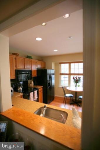 3323 Sea Port Way Silver Spring, MD 20902 - Photo 6 of 29 a view of kitchen with kitchen island a sink and a large window