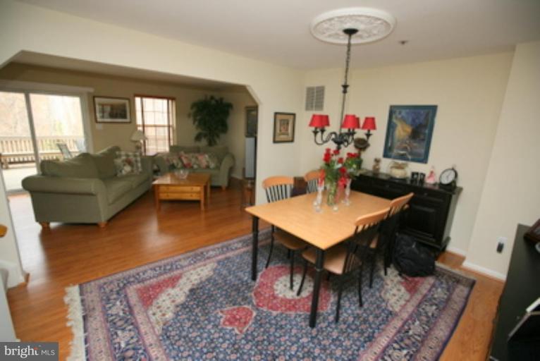 3323 Sea Port Way Silver Spring, MD 20902 - Photo 8 of 29 a living room with furniture and a table