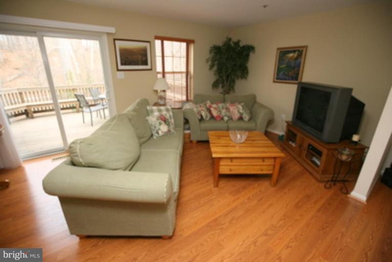 3323 Sea Port Way Silver Spring, MD 20902 - Photo 10 of 29 a living room with furniture and a flat screen tv