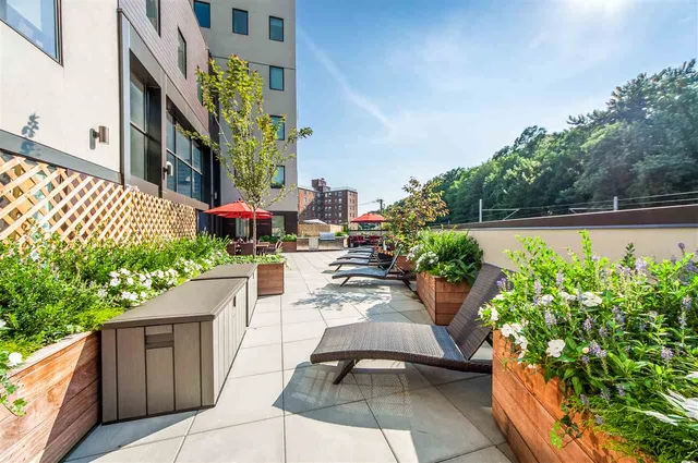 a view of a garden with sitting area