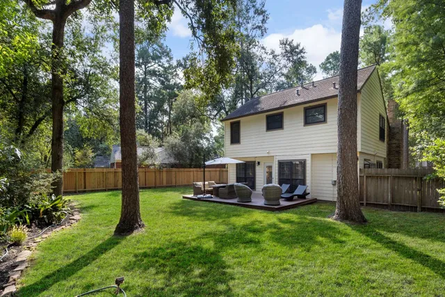 a view of a house with a backyard porch and sitting area