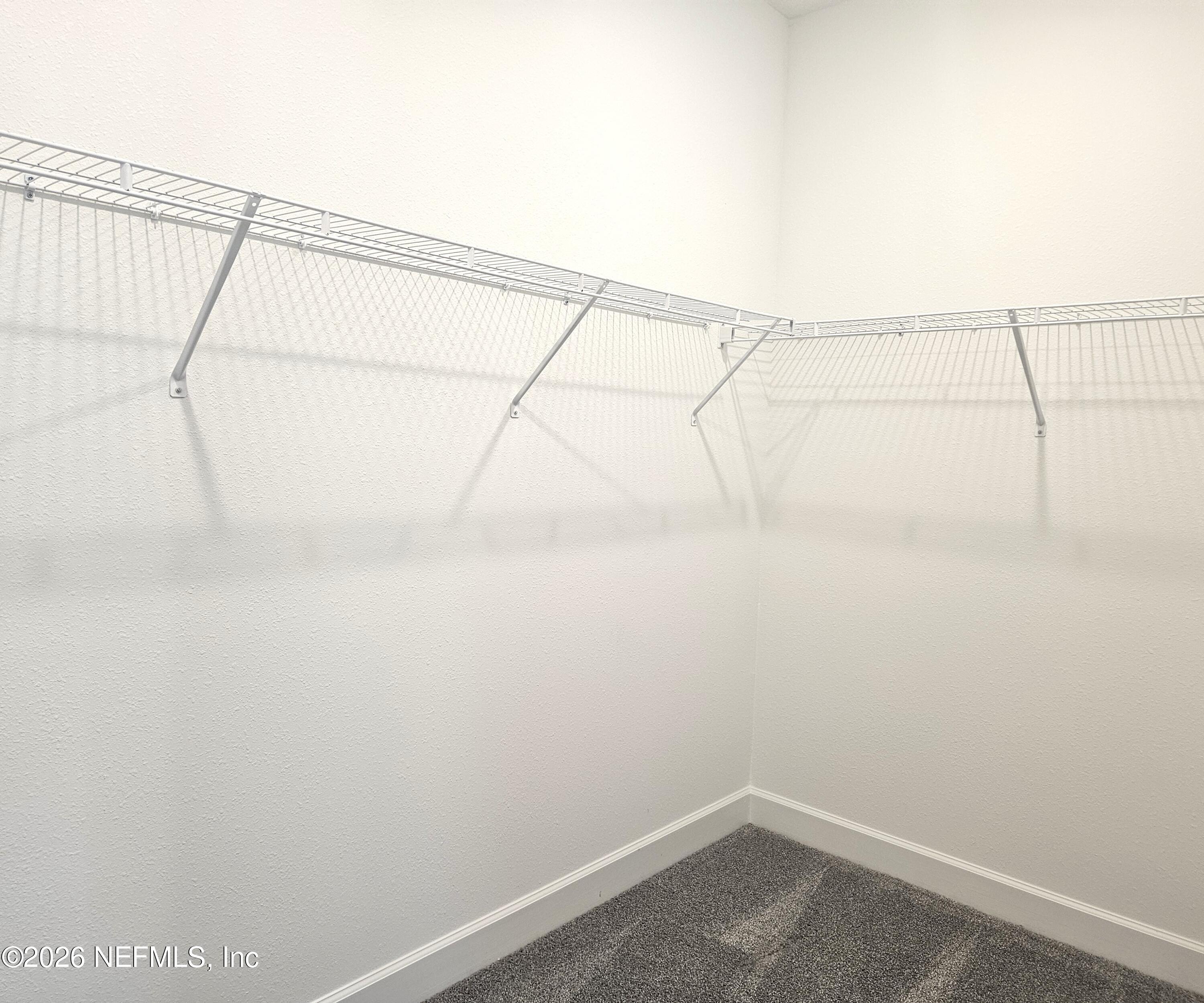 434 Cedar Elm Way St. Augustine, FL 32092 - Photo 15 of 27 a view of a room with racks on the wall