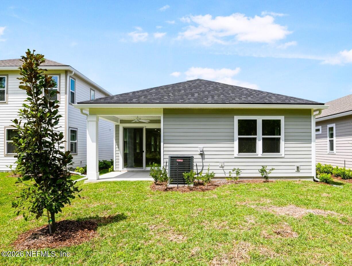 434 Cedar Elm Way St. Augustine, FL 32092 - Photo 20 of 27 a front view of a house with a yard